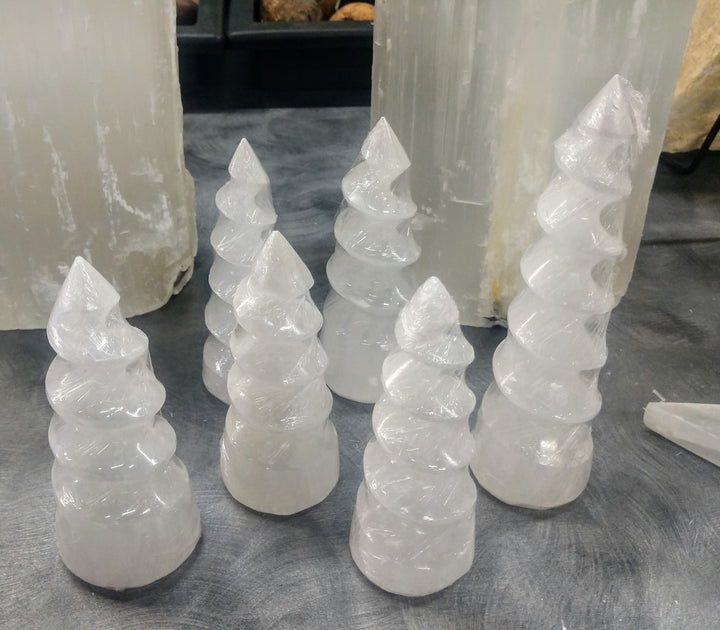 A protective stone, Selenite shields a person or space from outside influences. Selenite is a crystallized form of Gypsum, which is used for good luck and protection. The powerful vibration of Selenite can clear, open, and activate the Crown and Higher Chakras and is excellent for all types of spiritual work. It's also excellent for clearing your aura and other crystals.

Towers are rough cut and range slightly from 2 - 2.5" x 7"


