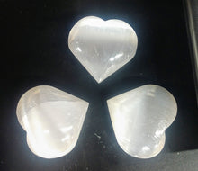 Load image into Gallery viewer, A protective stone, Selenite shields a person or space from outside influences. Selenite is a crystallized form of Gypsum, which is used for good luck and protection. The powerful vibration of Selenite can clear, open, and activate the heart and higher chakras and is excellent for all types of spiritual work. It&#39;s also excellent for clearing your aura and other crystals. by Buddha Gear