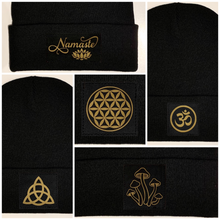 Load image into Gallery viewer, Beanies - Black Cuffed Buddha Beanie with Handmade Black and Gold Moon Phase patch over your Third Eye flower of life triquetra