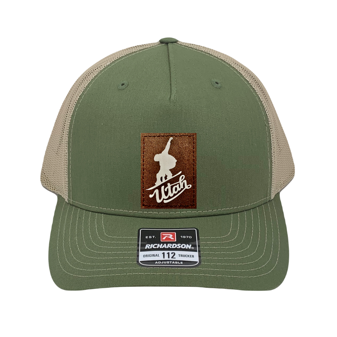 Richardson 112 trucker hat, olive/tan five panel hat with hand made, vegan leather brown/white Utah Snowboarder patch by Buddha Gear
