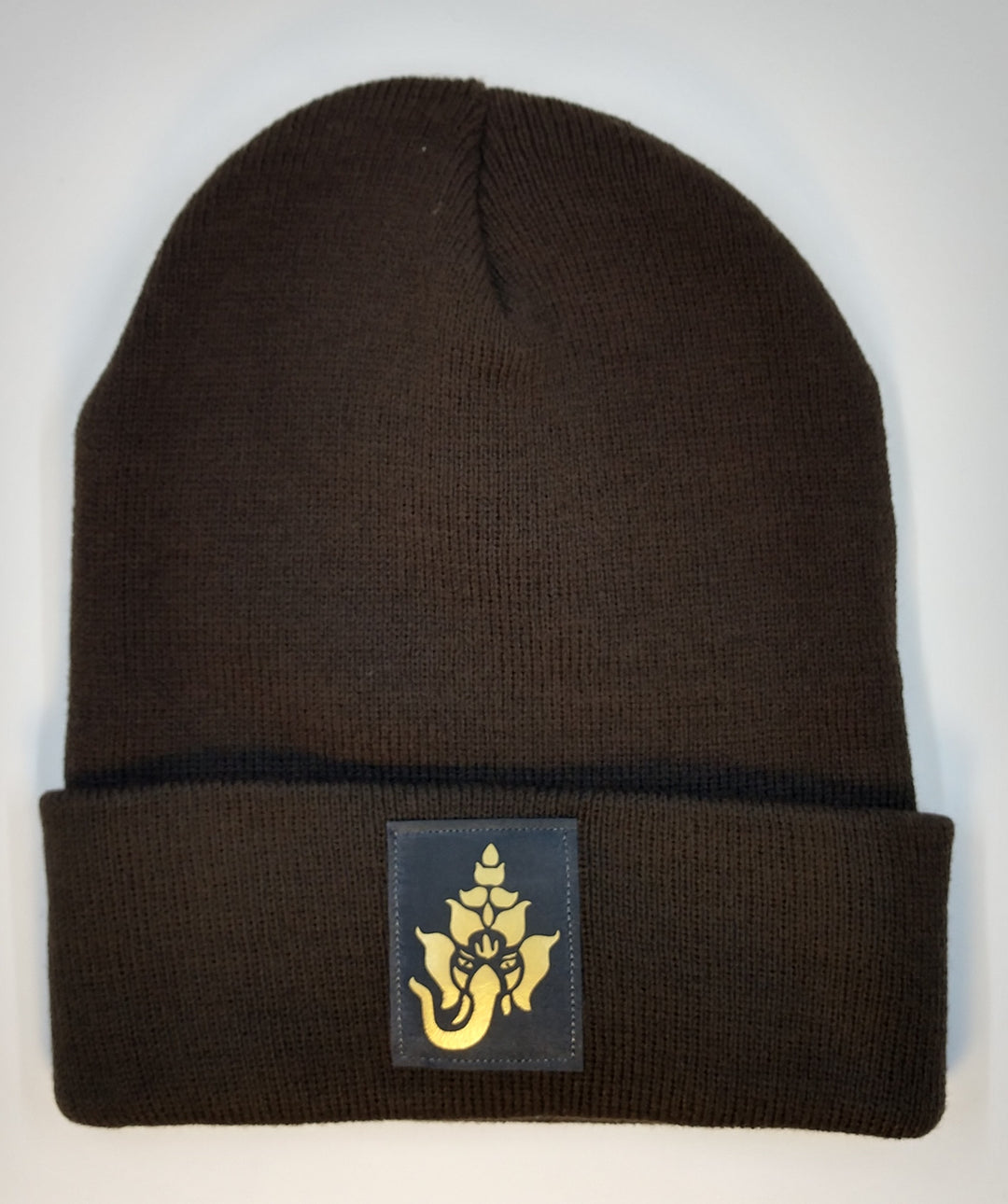 Buddha Beanie with Ganesha over your Third EyeGanesha is one of the most distinctive Hindu deities. He has a large elephant head and a soft bellied human body. He plays a dual role of a supreme being powerful enough to remove obstacles and ensure success or create obstructions for those whose ambition has become destructive.  Ganesha is an archetype that is often called upon when you’re about to embark on a new endeavor to bless the venture.